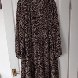 M&S ladies midi dress size 16 in leopard print design.Below the knee and with tiers.Never been worn.Ideal for work or casual.