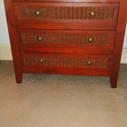 Mid size 5 Drawer Mahogany Wooden Bedroom Cabinet / Chest of Drawers. Fair condition.

Has a few scratches and marks on top surface but the drawers, wicker, back and sides are in good condition.

Dimensons are:- 
(W) 81cm (D) 36cm (H) 80cm

Wicker effect front with brass type knobs. Made of wood with mdf interior for drawers.

Part of another cabinet. Matching pair which is a Smaller 3 drawer Mahogany Wooden Bedside / Bedroom cabinet. Please see my other post if you are interested in both items.

Collection only. Can pay cash on inspection if preferred.