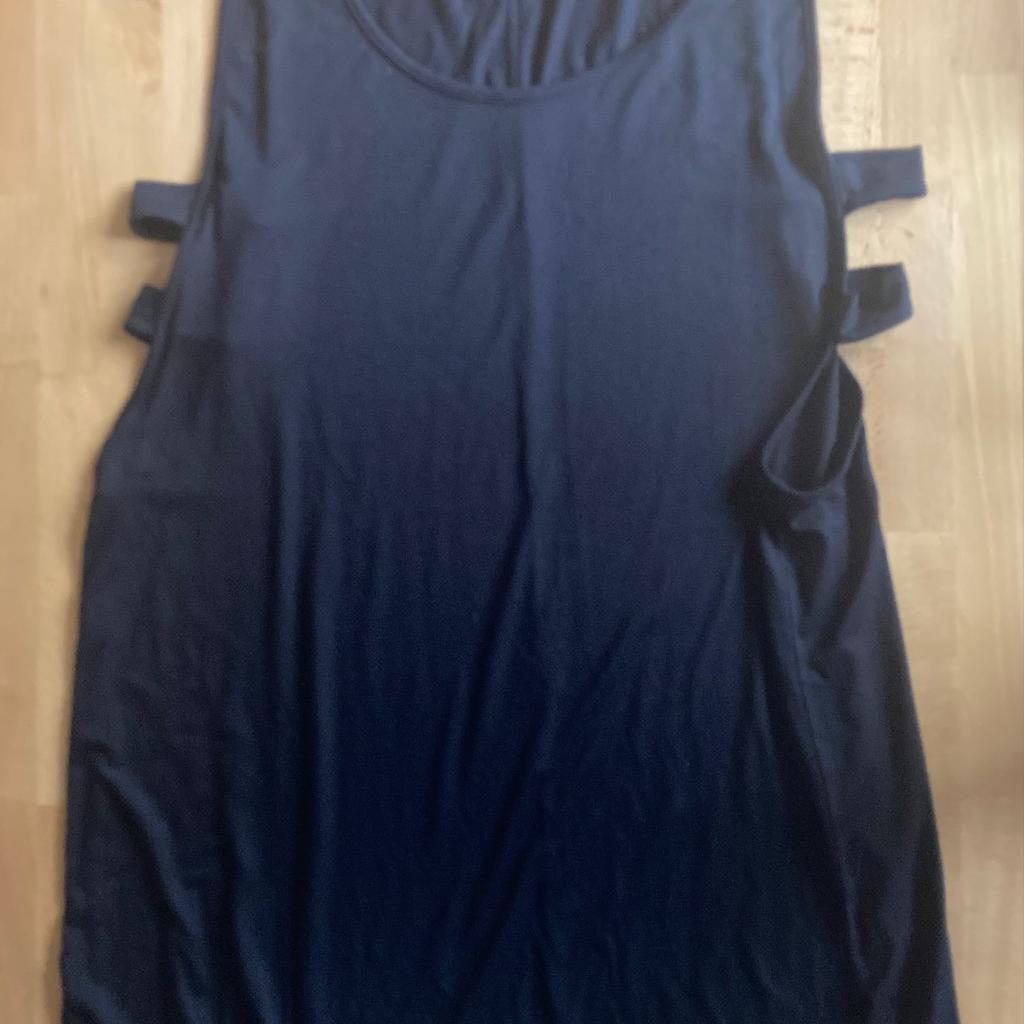 New. It can be worn over a T-shirt or another top or on a beach. The under arm cut is quite deep and revealing, but it meant to be. A quite original dress which is very comfortable and useful. Very black, but I could not achieve the blackness on the photos. It will fit any size between UK12-16.
