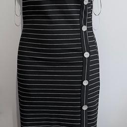 Black/white striped polyester midi dress.