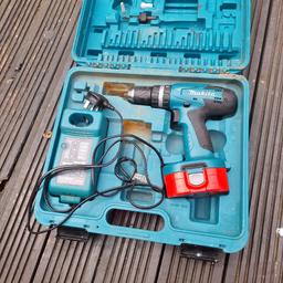 18 v cordless drill 2 speed hammer in used condition but works OK and does the job. with case. drill arbor and misc. bits and pieces. Charger and 1 battery