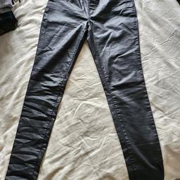 Dorothy Perkins Wet Look Black Jeans. Low waist and  elasticated back waist with fake pockets. 63% cotton. Size 12. Great condition.