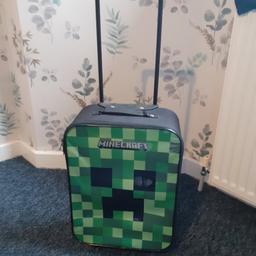Minecraft suitcase on wheels and pull handle, in lovely clean condition. smoke free home. used a couple of times, plenty of life left in it. cash on collection only. NO OFFERS