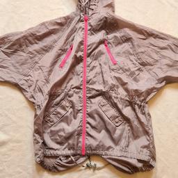 Ladies New Grey And Pink Lightweight Rain Jacker/ Anorak. Great Condition. Uk12. See photos for condition, flaws, size and materials. I can offer try before you buy option if you are local but if viewing on an auction site viewing STRICTLY prior to end of auction.  If you bid and win it's yours. Cash on collection or post at extra cost which is £2.85. Royal Mail 2nd class. I can offer free local delivery within five miles of my postcode which is LS104NF. Listed on five other sites so it may end abruptly. Don't be disappointed. Any questions please ask and I will answer asap.