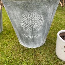 Pair of galvanised planters suitable for a tree
50 cm tall 52 cm Diameter
Ready for use
Attractive design with rope handles
Plant pot only to demonstrate size 
Collection only