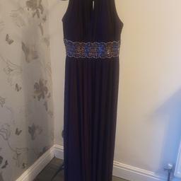 dark purple or a plum colour maxi dress,like new,wore once for a few hours,also have same colour sleeved top to wear undernesth if interested