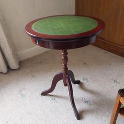 rond top side table with green faux leather inlay. 60.5 cm high 40.6 cm diameter top in very good condition. collection only please