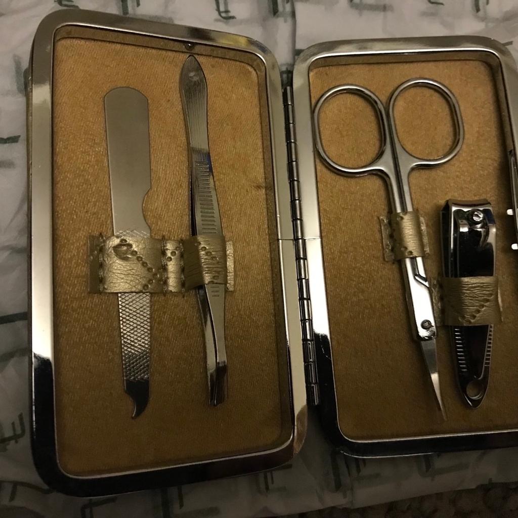 Never Used
Really Cute Mini Manicure Set
In Lovely Gold Coloured Case
Very compact and handy
Has fine curved scissors as well