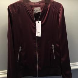 Ladies plum purple outerwear jacket from Next. Size 10. Zip closure with 2 front zip pockets. New with tags.
