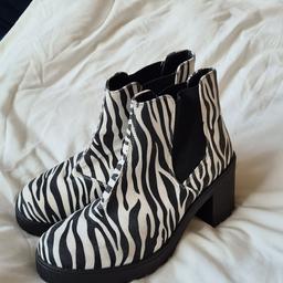 Ladies Schuh Zebra Print Size 7 Ankle Boots In Very Good Condition. See photos for condition, flaws, size and materials. I can offer try before you buy option if you are local but if viewing on an auction site viewing STRICTLY prior to end of auction.  If you bid and win it's yours. Cash on collection or post at extra cost which is £4.55 Royal Mail 2nd class. I can offer free local delivery within five miles of my postcode which is LS104NF. Listed on five other sites so it may end abruptly. Don't be disappointed. Any questions please ask and I will answer asap.