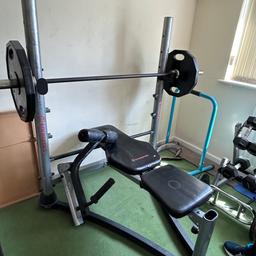 Two 25 kg two20kg  two 10kg then assortment of dumbbells complete with bench and leg extension 3 bars one 20kg and dip stand