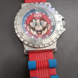 Mario watch, worn a few times and in excellent condition. Needs a new battery. Pick up only. Picture next to a £2 coin for size reference.