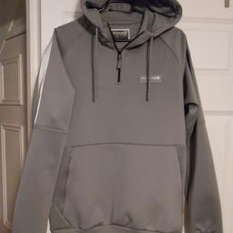Mckenzie over the head hoodie. 
Grey in colour 
size Medium will also fit teenager 13-14 (small 15 year old)
Great condition 
from a clean smoke pet free home. 
collection B45.