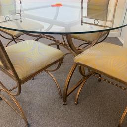 Round glass topped table and four chairs in good used condition chairs have been recovered stunning metal work £40ono