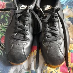 Nike cortex size 5.5 will fit adult and youth excellent condition only worn couple of times, black leather, tick has a dark grey pattern, can be put in a Nike box if wanted collection only