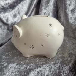 Brand new item a small money box with sparkly stars