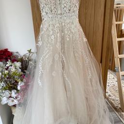 Used wedding dress- very flattering on the body

Fits size 8/10

There is slight pulls under the dress. A few part at the front are slightly torn from guests stepping on it accidentally but you don’t notice them when wearing the dress. Also I added the underskirts too

£250 open to offers