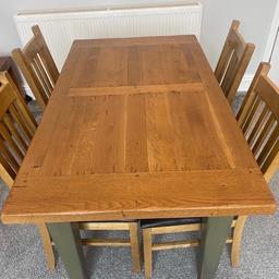 Solid wood table with 4 chairs

Extendable add on also comes with it 45 cm

130 cm x 76 cm rustic looking with draw underneath

Legs and underside have been painted light green and has worn off in places

Collection and Cash it comes with 4 good chairs and an extendable add on so its a bargain could sit 6 people

No time wasters please.
