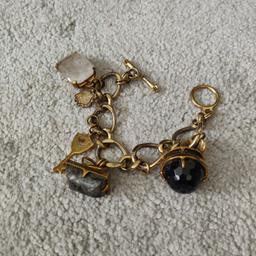 Here I have this Juicy couture bracelet with different coloured stones attached. I'm not sure what type of gold metal this is but is slightly faded but may come up nice with a polish.
Collection preferred from Dagenham or I can post it at your expense. I DON'T USE SHPOCK WALLET. Please check my other things available thanks.