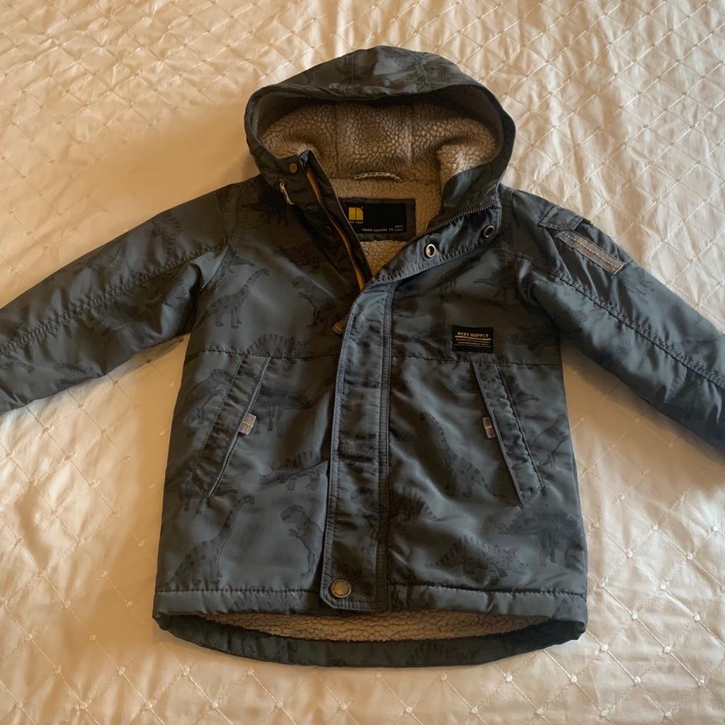 This khaki Waterproof Dinosaur Coat is from Next and for a boy aged 3-4 years. It’s in good condition and has been washed. It has the velcro missing off the front as you can see in the picture but functions perfectly well. It is from a pet and smoke free home. Bought for £40. Open to offers. Can deliver if local for free.