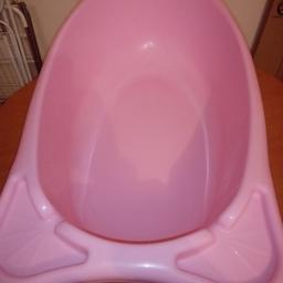 A large pink bath tub