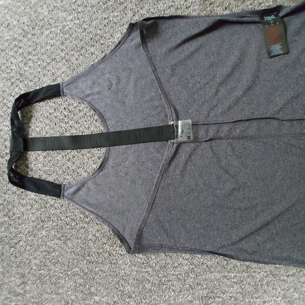 T-Shirt"Everlast"

 Greatness is Within

 Grey Mix Colour

 Good Condition

Actual size: cm

Length: 65 cm from nape (neck) front

Length: 68 cm from nape (neck) back

Length: 35 cm from armpit side

Volume hands: 88 cm from nape (neck)

Volume bust: 95 cm – 98 cm

Volume waist: 90 cm – 95 cm

Volume hips: 90 cm – 98 cm

Size: 12 (UK) Eur 40, US 8

Body: 100 % Polyester

Mesh: 80 % Nylon
 20 % Elastane

Made in China