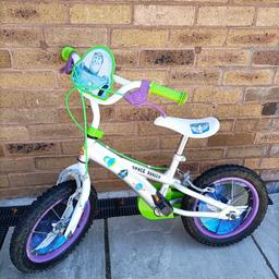 Buzz Light-year bike. 12 inch wheels. £90 in Halfords. Used and some sun damage, marks and scratches. But perfect working condition.
