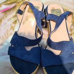 Ladies Kanna Blue Suede Heeled Sandals Uk 5 In Very Good Condition. Grab Them Quick. See photos for condition size flaws materials etc. I can offer try before you buy option if you are local but if viewing on an auction site viewing STRICTLY prior to end of auction.  If you bid and win it's yours. Cash on collection or post at extra cost which is £4.55 Royal Mail 2nd class the bundle deal will cost £11 to post the whole bundle. I can offer free local delivery within five miles of my postcode which is LS104NF. Listed on five other sites so it may end abruptly. Don't be disappointed. Any questions please ask and I will answer asap.