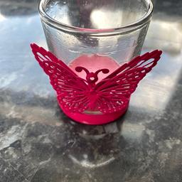 A pink butterfly tealight candle holder with frame and glass. Happy to post if buyer covers cost of postage.
