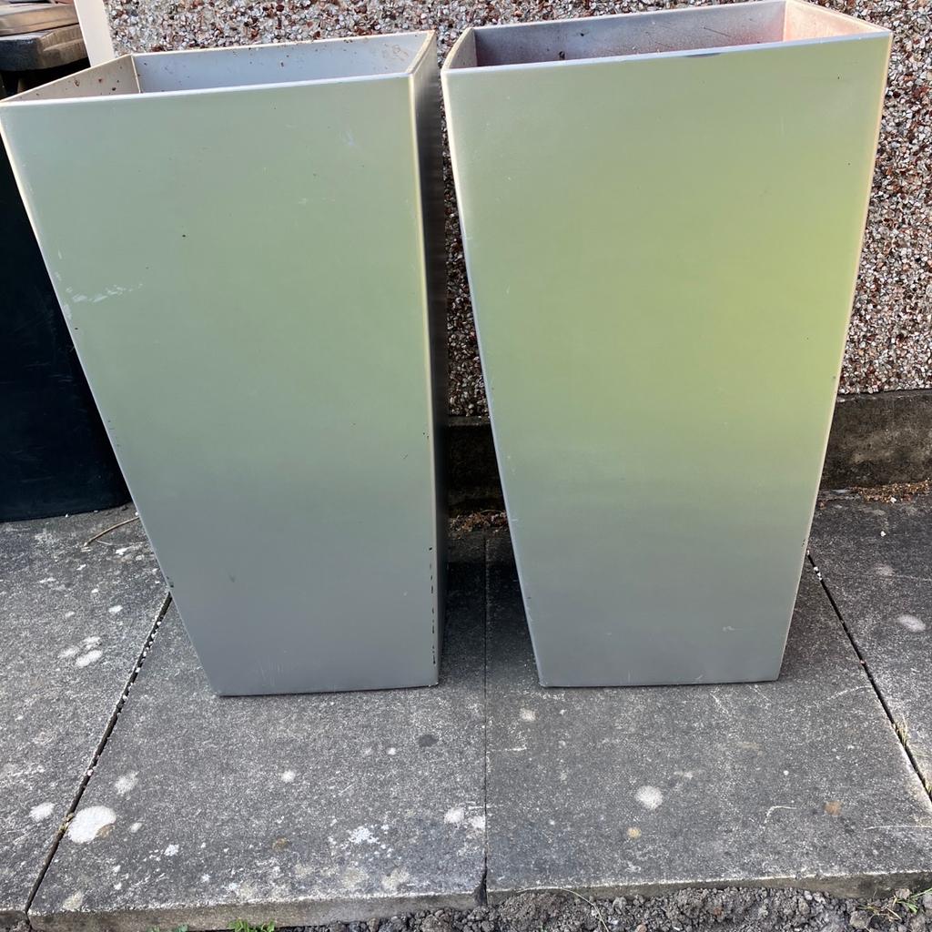 Two large grey plastic plant pots. Superb condition. Never used. Dimensions: width 500mm, Depth 500mm, Height 940mm. Will sell separately. Would deliver locally