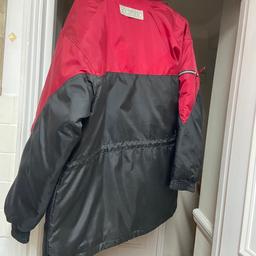 A brand new waterproof jacket. With light weight padded lining. Has tie up waist if required.