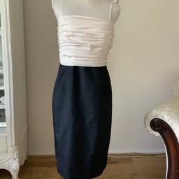 Cocktail dress black satin with cream chiffon top
With or without straps Fully lined
Size 18
Teatro brand