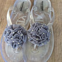 Pretty grey plastic flip flops in very good condition. Collection only please