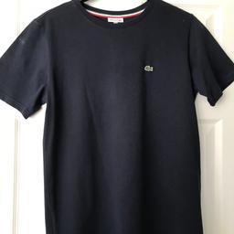 Navy Lacoste T-shirt aged 16yrs
Great condition 
Pet free smoke free home 
Buyer to collect or happy to post with postage extra