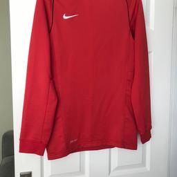 Red Nike Dri Fit Small Mens Top
Great condition 
Pet free smoke free home 
Buyer to collect but happy to post with postage extra