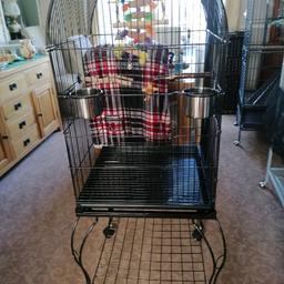 Loverly large bird cage with stand suitable for most birds it's had 2 conures in it but have moved them to the aviary would also be OK fot a few Budgies or other parakeets the cage is in good condition clean and ready to use - - 50 pounds sorry no offers