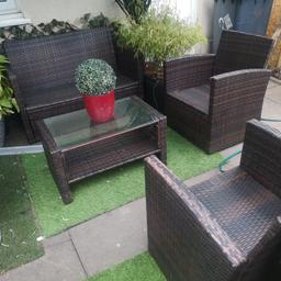 Rattan garden 4 piece set, 2 seater, 2 chairs and glass top table. No cushions. Can deliver local for fuel.