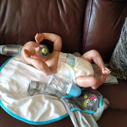19" Reborn baby doll,hand painted boy body,comes with magnetic dummy, bottle birth certificate, blanket and clothes he has on..