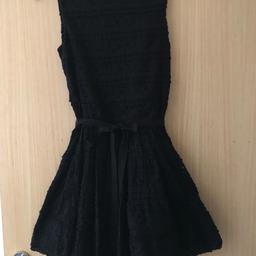Gorgeous little black dress.
The fitting and shape is perfect to dress up or down.
Back zip closure - with a waist tie.
Fully lined which adds volume to the dress.. looks stunning when worn.