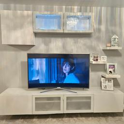white high gloss ikea media wall in excellent condition comes with glass top. paid 600 only selling due to getting media wall made with built in fire