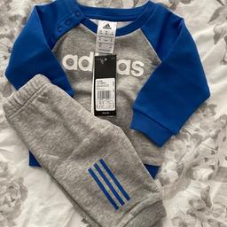Grey & royal blue tracksuit by Adidas. Poppers on jumper. 0-3m 
Ferryhill collection only