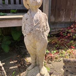 This is a lovely large stone ornament of a boy in good condition