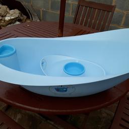 Blue baby bath tub with wash basin wipe