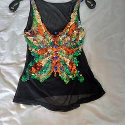 Beautiful detailed butterfly vest. size 10 see through apart from the sequence butterfly on the front.