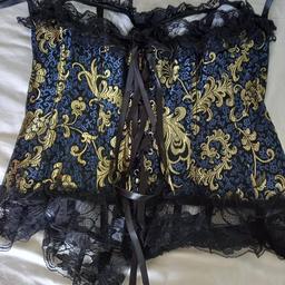 2 beautiful sexy basques. 1 navy + gold fastens at the front brand new size L + ties at the back so could fit 10-14. The greeny blue size 12 from Topshop zipps up back + ties. Both lovely detailed. £12 for both.