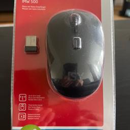 En helt ny trådlös mus i sin förpackning.