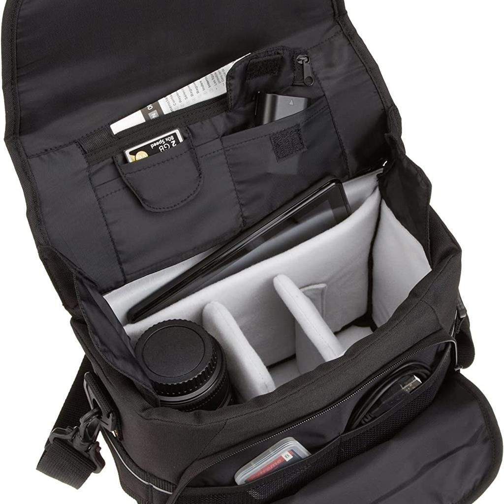 DSLR Gadget Messenger Bag, Black With Grey Interior

DSLR Gadget Shoulder Bag Large Camera Accessories Basic Messenger
Modern Elegant
Black Messenger Bag with Grey Interior:

Store, carry and protect your camera equipment
Compartment for iPad Mini, Google Nexus 7 and Amazon Kindle Fire
Holds 1 DSLR camera body and 2 lenses
Internal Dimensions: 10.2" x 3.7" x 6.8" (LxWxH)
External Dimensions: 11.6" x 4.9" x 7.8" (LxWxH)
The Amazon Basics Medium DSLR Gadget Bag is a must have for carrying your DSLR camera, lenses,
and other camera accessories.
No matter what equipment you use, the removable interior of the Amazon Basics backpack can be
adjusted to fit a DSLR camera body, two lenses, and other accessories.
The large gadget bag features a padded slot that is able to fit iPad mini, Kindle Fire, Google Nexus 7, and other small devices. Additional pockets in the front offer a space for a cell phone and other electronics and accessories