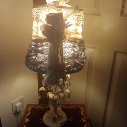 Vintage style table lamp with home made shade and metal base with glass droplets- old, so in used condition with some age related wear. This adds to the charm. Lamp works perfectly. It stands approx 1ft 11 inches high. Collection only from Stourbridge. Delivery /postage not available. Priced to reflect the fact that the shade is home made.
