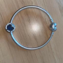 Beautiful stunning pandora bangle ..few stones missing from the charm ..bangle was £55 n charm was £75 in good condition