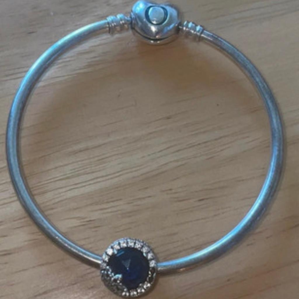 Beautiful stunning pandora bangle ..few stones missing from the charm ..bangle was £55 n charm was £75 in good condition